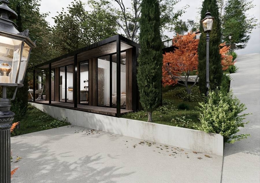 Cabaña con ventanales de piso a techo junto a un farol